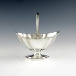 A George III silver swing-handled sugar basket, by Abraham Peterson, London 1790, shaped oval