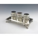 A George IV silver inkstand, by Joseph Angell, London 1821, rectangular form, shell and gadroon