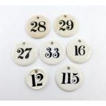 A collection of seven ceramic bin labels, one by Copeland, others various makers, circular form,