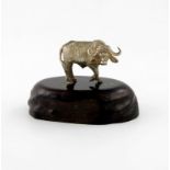 By Patrick Mavros, a silver model of a buffalo, in a standing position, on a wooden plinth, total