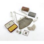A mixed lot of small silver items and objects of vertu, including: a gilt metal card case, in a