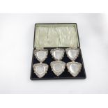 A set of six late-Victorian clip-on ashtrays, by Walker and Hall, Sheffield 1899-1900, triangular