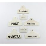 A collection of seven ceramic bin labels, some by Wedgwood, Copeland and Minton, arched