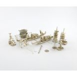 A mixed lot of silver miniatures, comprising oriental items: a pair of pagoda pepper pots, a