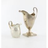 A silver cream jug, by Charles Edwards, London 1927, plain helmet form, beaded border, on a square