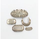A small collection of silver wine labels, comprising: a foliate scroll label by Matthew Linwood,