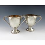 A pair of Regimental silver trophy cups, by Mappin and Webb, Sheffield 1922, circular form,