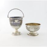 An Edwardian silver swing-handled sugar basket, by James Jay, Chester 1903, circular urn form,