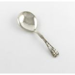 By Georg Jensen, a Danish silver Leaf and Berry serving spoon, design no. 71, circa 1915-32, the