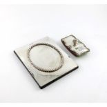 A silver blotter pad, by S. Blanckensee and Son, London 1912, rectangular form, applied oval rope-