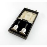 A pair of regimental silver table bells, by J. Gloster Limited, Sheffield 1935, tapering form,