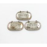 A set of three George III silver wine labels, by Edward Edwards, London 1813, oblong form, gadroon