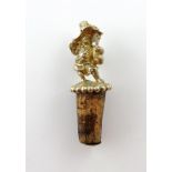 A Victorian silver-gilt bottle stopper, by Robert Hennell, London 1858, modelled as a standing