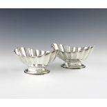 A pair of Edwardian silver bon bon dishes, by Heath and Middleton, Birmingham 1903, fluted oval