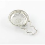 A George III silver lemon strainer, maker's mark partially worn ?L, London 1778, circular form,