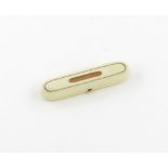 λ A George III ivory toothpick box, circa 1800, oblong form, the hinged cover with a gold