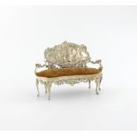 An Edwardian novelty silver sofa pin cushion, by William Comyns, London 1902, in the Rococo