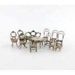 A collection of silver miniature furniture, comprising: a late 19th century settee and two chairs, a