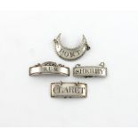 A small collection of four antique silver wine labels, comprising: a crescent label, by Phipps and