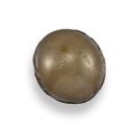 A toadstone, of circular cabochon form. 1.5cm long. Toadstones, named for their resemblance to the