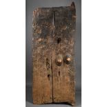 A Dogon door Mali wood, one panel carved a pair of breasts, 145.5cm high, 58cm wide. Provenance