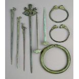 Nine bronze artefacts Roman and later including six pins, with bird, rosette and figural