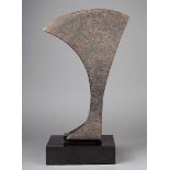 A continental iron axe head 39cm long, on a stand. (2) Provenance Seward Kennedy, London.