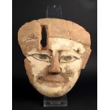 An Egyptian wood and gesso mummy mask Late Period, circa 664 - 332BC with remains of painted eye