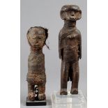 Two Zigna fetish figures Tanzania wood, with encrusted bound cloth, the female with bead eyes and