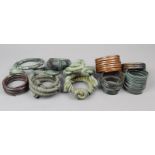 Six coiled armbands copper and brass, and four Yoruba twisted brass currency armbands, three with