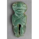 A Maya amulet Mesoamerica jade of figural form with the arms laid to the chest, pierced for