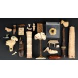 A collection of antiquities including a gilt metal shield boss, two bone handles, two sword handles,