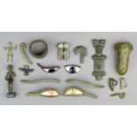 A group of bronze antiquities including a pair of Egyptian bronze eyes with stone insets and lashes,