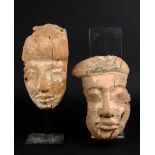 Two Egyptian wood mummy masks Ptolemaic Period, circa 332 - 30BC one with remains of cartonnage