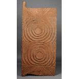 An Igbo door Nigeria wood, with deep carved concentric circles and chevrons, 101.5cm high, 46cm