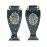 A pair of Ernst Wahliss pottery vases, model no.9979, urn shaped, square section printed and painted