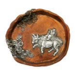 A Gorham & Co mixed metal small tray, applied with a figure riding a water buffalo whilst playing