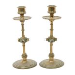 A pair of Gothic Revival brass candlesticks, turned and knopped central column on flaring base,