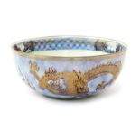 A Wedgwood Dragon lustre bowl designed by Daisy Makeig-Jones, printed with ferocious dragons in gold