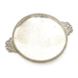 An A.E. Jones electroplated metal twin-handled bowl, the handles cast with scrolling foliage, with