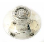 An Alwyn Carr silver capstan inkwell, tapering circular form applied pen rest, hinged cover cast