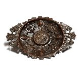 A bronze dish in Renaissance revival style, with mythical beast and grotesque mask handles, the