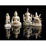 λ Four Indian carved ivory figures, one depicting Buddha, Ganesh, Saraswati, and one of a standing