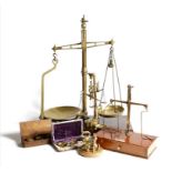 A collection of balance scales, comprising: a brass set with a mahogany box base by D.E. Grave Short