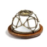 A French opaline glass inkwell, decorated with bronze rope work, with a lift-off lid on a mahogany