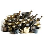 A large collection of mortars and pestles, in bronze, bell metal, brass, iron, stone and wood,