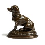 After Emmanuel Frémiet (French 1824-1910). A bronze model of a seated dachshund, the naturalistic