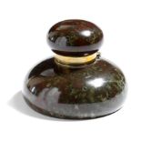 A late Victorian Cornish serpentine inkwell, with brass mounts and a glass liner, 10.2cm diameter.