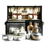 A 'Sirram' car picnic set for lunch and tea, fitted with plates, cutlery, whicker and glass bottles,