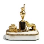 A Regency gilt and patinated bronze inkstand retailed by the Thomas Weeks Museum, modelled with a